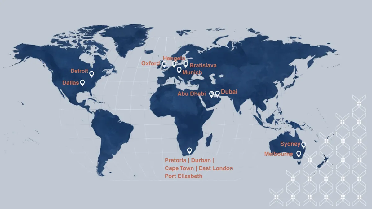 A desk with a computer monitor showing a design with a lightbulb icon that says IDEAS