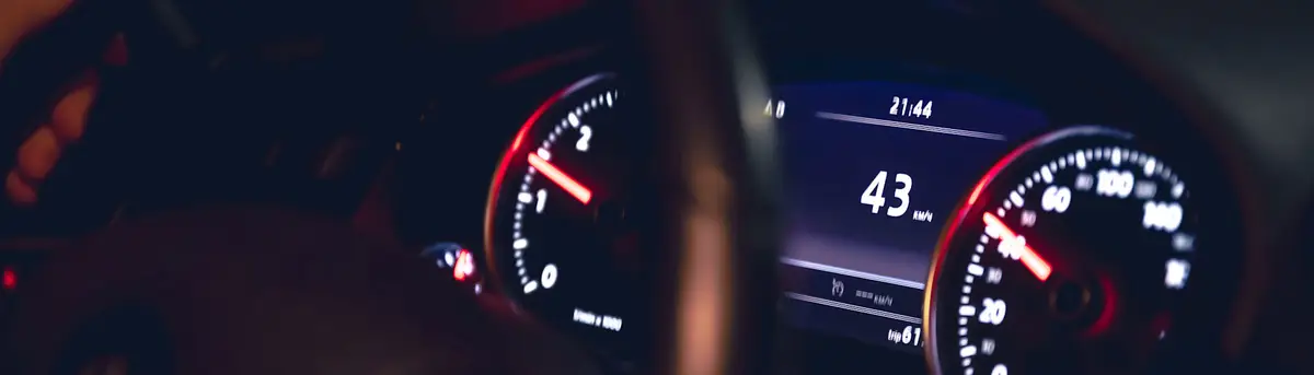Driver at the steering wheel at night